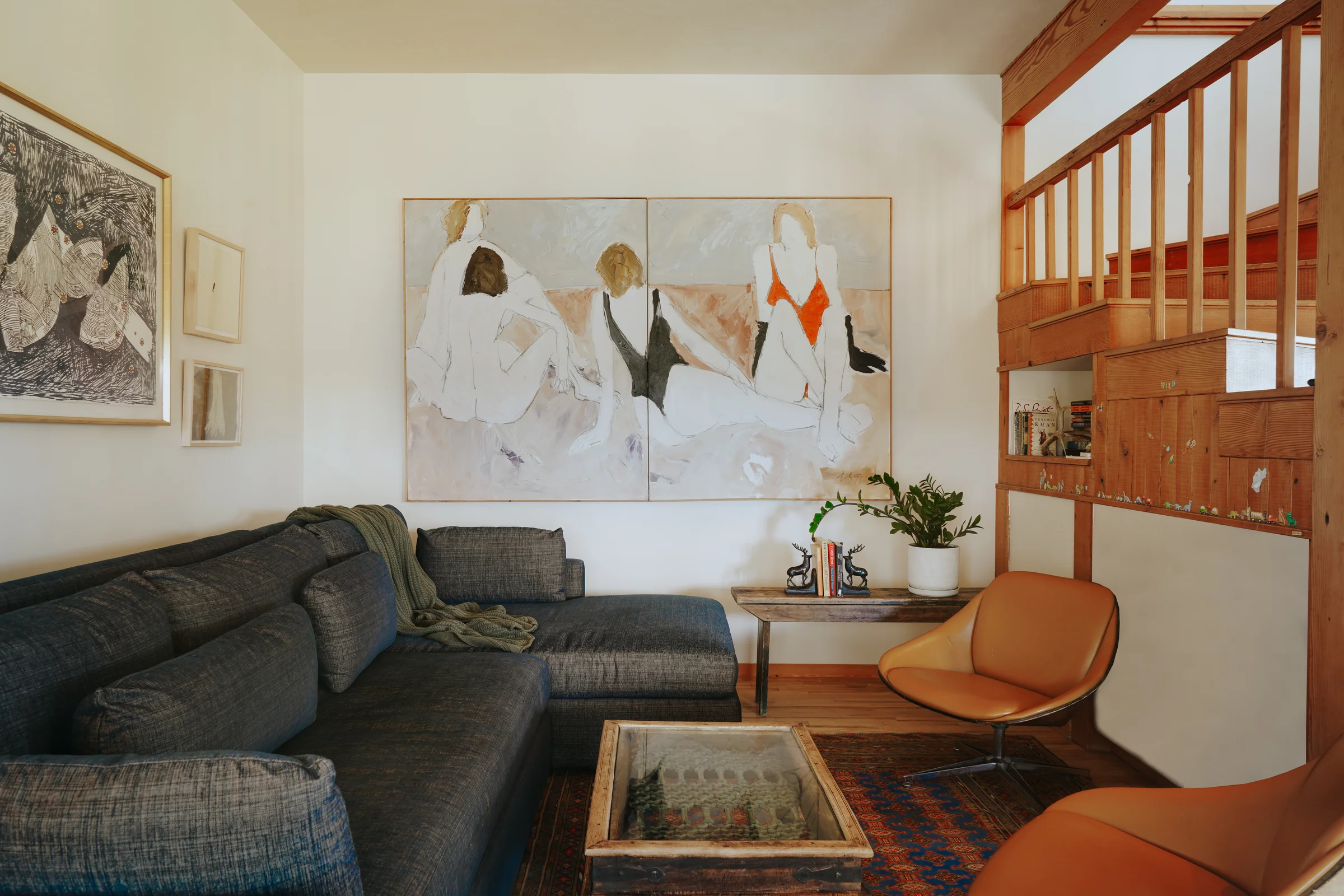 FOUR 1-91 by Freeman W. Butts hanging above a sofa in a living room